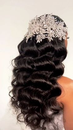 the back of a woman's head wearing a wedding hair piece