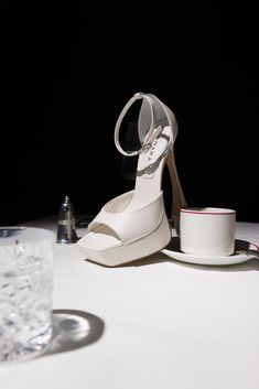 Lamara London Fly Away is our squared toe best-selling platform made in white napa leather. This style presents a 130mm sculptural heel and 30mm platform (the perceived height is 100mm), both covered in matching white leather. #lamaralondon #style #glamour #shoe #heels #party #fashion #chic #aesthetic #bridal #wedding Ideas Navidad, Clear Heels, Personal Project