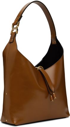 LWG-certified crackled calfskin tote in tan. · Studs throughout · Logo hardware at integrated shoulder strap · Logo embossed at face · Tab-slot closure · Zip pocket at suede interior · Logo-engraved gold-tone hardware · H8.5 x W10.5 x D3 · Total height: H18 Supplier color: Clay brown Cognac Calf Leather Shoulder Bag With Gold-tone Hardware, Brown Calf Leather Satchel With Gold-tone Hardware, Brown Satchel With Gold-tone Hardware For Work, Brown Workwear Satchel With Gold-tone Hardware, Modern Brown Bucket Bag With Gold-tone Hardware, Modern Brown Shoulder Bag With Gold-tone Hardware, Modern Brown Satchel With Gold-tone Hardware, Brown Calf Leather Bucket Bag With Gold-tone Hardware, Brown Calf Leather Bucket Bag With Leather Lining