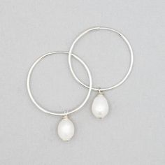 Freshwater natural pearl ovals handwired in sterling silver or 14k goldfill hoop drops. Drops 12mm X 8mm are made to fit Jewel Ya hoop earrings. Hoops are sold separately. Oval Pearl Drop Hoop Earrings Gift, Minimalist Pearl Drop Hoop Earrings For Anniversary, Minimalist Small Hoop Pearl Drop Earrings, Everyday Hoop Earrings With Pearl Charm In Sterling Silver, Sterling Silver Hoop Earrings With Pearl Drop For Everyday, Everyday Sterling Silver Hoop Earrings With Pearl Drop, Sterling Silver Small Hoop Pearl Earrings For Everyday, Everyday Small Hoop Sterling Silver Pearl Earrings, Everyday Sterling Silver Hoop Pearl Earrings