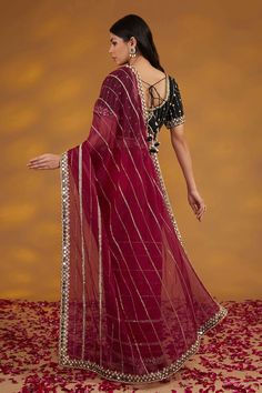 Maroon saree with linear pattern hand embroidery and mirror work on borders. Comes with contrasting padded blouse and a petticoat. - Aza Fashions Semi-stitched Anarkali Set With Mirror Work For Traditional Ceremonies, Transitional Pre-draped Saree With Dori Work, Traditional Georgette Wear With Mirror Work For Ceremonies, Georgette Saree With Sheer Dupatta For Traditional Ceremonies, Traditional Wear Saree With Sheer Dupatta, Anarkali Blouse Piece With Mirror Work For Navratri, Traditional Pre-draped Saree With Mirror Work For Eid, Traditional Chinon Wear With Mirror Work For Ceremonies, Navratri Sharara With Mirror Work Shaped As Saree