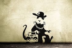 a cat with a hat on its head is next to a boombox and radio