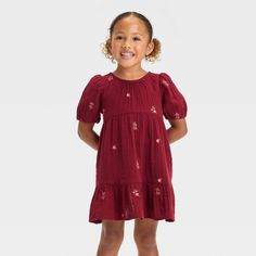 Add a sweet look to your tiny tot's closet with this Floral Short-Sleeve Dress from Cat & Jack™. This short-sleeve dress in a knee length sports a casual crewneck, soft gathers on the waist, a tiered hem and allover floral embroidery for cute style. The soft cotton gauze fabric with lining lends comfortable all-day wear, and the keyhole behind-neck button closure makes dressing easy. Plus, the side pockets provide space for their favorite small toys. Cat & Jack™: Designed for all children so you Cute Red Short Sleeve Dress, Red Short Sleeve Dress For Playtime, Casual Red Short Sleeve Dresses, Cute Red Puff Sleeve Dresses, Girls Floral Dress, Cotton Gauze Fabric, Cozy Dress, Floral Embroidered Dress, Floral Short