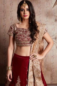 This set features a maroon semi velvet dori work lehenga choli set. It comes along with zari and dori lace work on dupatta and heavy embroidery butta on dupatta. Matching blouse with heavy dori work and zari work.Product Features: Lehenga Color: Maroon Blouse Color: Maroon Dupatta Color: Beige Lehenga Fabric: Velvet Silk Blouse Fabric: Velvet Silk Dupatta Fabric: Net Style Name: Circular Style Lehengas Work: Zardosi, Jari Embroidery With Stone Work Occasion: Wedding-guest Size: Customised Upto 4 Maroon Bridal Lehenga, Maroon Dresses, Maroon Lehenga, Dresses Dinner, Velvet Lehenga, Indian Lehenga Choli, Pakistani Style, Dress Maroon, Punjabi Outfits