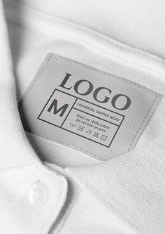 a white shirt with a label on it that says logo m in black and white