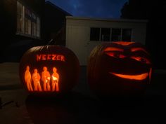 two carved pumpkins with faces and people on them, one is lit up at night