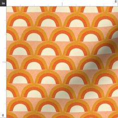 an orange and white pattern with circles on it's side, as well as a ruler