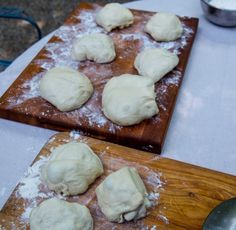 doughnuts sitting on top of wooden cutting boards