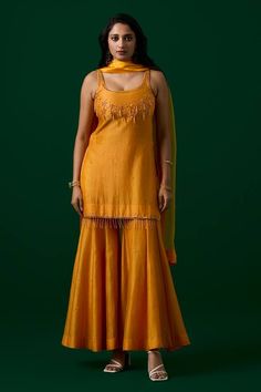 Yellow kurta with floral crystal hand embroidery and tassels on hem. Paired with a sharara with floral butti all over and a matching dupatta. - Aza Fashions Kurta And Sharara, Chanderi Silk Suits, Brocade Lehenga, Yellow Kurta, Women Kurta, Sharara Suit, Floral Set, Straight Kurta, Indian Heritage