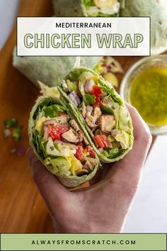 chicken wrap with lettuce and tomatoes in it