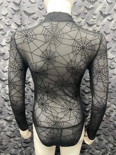 This is an Official Part 1 spiderweb pattern sheer long sleeve black bodysuit. This has The Part 1 image screen printed on the front. 95% nylon / 5% spandex These are handmade screenprinted and slightly vary from the photo. Please feel free to email me any questions. Thanks for looking. Due to an influx of incorrect addresses if a package is returned, you must pay the shipping cost to resend the item to you. I do not do exchanges and I do not take returns unless the item is damaged. I thoroughly Spider Web Costume Women Diy, Stretch Bodysuit With Sheer Long Sleeves, Night Out Long Sleeve Bodysuit With Mesh Sleeves, Black Party Bodysuit With Sheer Sleeves, Sheer Stretch Long Sleeve Bodysuit, Black Long Sleeve Sheer Bodysuit, Sheer Long Sleeve Stretch Bodysuit, Gothic Bodysuit For Halloween Costume Party, Fitted Halloween Festival Bodysuit