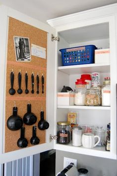 an organized pantry with utensils and other kitchen items