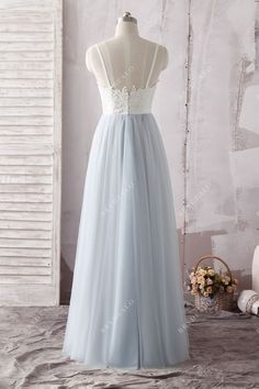 Combined with delicate ivory lace and soft ice blue tulle, this elegant Two Tone Lace Tulle Sweetheart Floor Length Casual Bridal Gown features sweetheart neckline, spaghetti straps and low back. The floor length A-line skirt flows with every step. Wear this beautiful gown on your wedding day for the true romance at heart. shown color two-tone( light ivory/ice blue) bra support with cups boning yes closure back zipper lining fully lined *Color options are only for skirt. The top remains in Light Bridesmaid Gown With Sheer Tulle Bodice, Bridesmaid Gown With Illusion Neckline In Tulle, Bridesmaid Gown With Illusion Neckline, Blue Tulle Gown With Sheer Bodice, Bridesmaid Gown With Lace Back And Sweetheart Neckline, White Bridesmaid Dress With Lace Bodice, Tulle Gown With Lace Bodice For Debutante Ball, Blue Tulle Wedding Gown, Blue Tulle Dress With Lace Trim