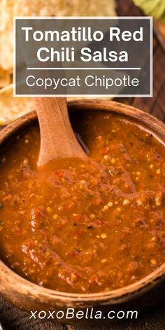 tomato chili red chili salsa in a wooden bowl with a spoon