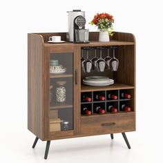 a wooden cabinet with wine glasses and plates on it