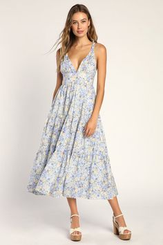 Your sweet disposition calls for a sweet dress to match, and the Lulus Brightly Blossoming Light Blue Floral Tiered Midi Dress will be a perfect fit! Lightweight woven cotton boasts a lush floral print as it shapes braided straps that support a V-neck bodice, atop a banded waist. Tiered skirt has an A-line silhouette, side pockets, and falls to a sunny midi hem. Hidden back zipper/clasp. Light Blue Midi Dress, Sweet Disposition, Maternity Midi Dress, Floral Print Midi Dress, Tiered Midi Dress, Floral Blue Dress, Wedding Outfits, Blue Midi Dress, Sweet Dress