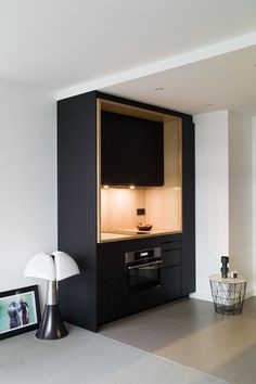 Black and natural wood kitchem module Hotel Kitchenette, Apartment In France, Kitchenette Design, Tiny Kitchen Design, Small Kitchen Cabinets, Small Apartment Interior, Hotel Interior Design, Hotel Interior