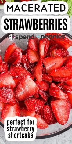 a bowl filled with sliced strawberries on top of a table