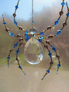 a spider made out of glass and beads