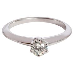 Tiffany & Co. Diamond Solitaire Ring in 950 Platinum I VVS1 0.31 CTW PRIMARY DETAILS SKU: 123649 Listing Title: Tiffany & Co. Diamond Solitaire Ring in 950 Platinum I VVS1 0.31 CTW Condition Description: Retails for 2750 USD. In excellent condition and recently polished. Ring size is 4.25. Comes with Box, Appraisal and Tiffany Diamond Certificate. Brand: Tiffany & Co. Metal Type: Platinum Metal Purity: 950 Ring Size: 4.25 Pre-Owned Jewelry Condition: Excellent CENTER STONE INFORMATION Center Stone 1 Type: Diamond Center Stone Weight 1 (cts): 0.31 Center Stone 1 Shape: Round Center Stone 1 Color: I Center Stone 1 Clarity: VVS1 Center Stone 1 Cert Type: Tiffany Certificate Center Stone Cert Number 1: G05020138 SIDE STONE INFORMATION Original Box?: Yes Original Papers?: Yes Diamond White Solitaire Diamond Ring For Formal Events, Formal Single Diamond Ring In Lab Grown Diamond, Vvs Clarity 14k White Gold Ring With Classic Cut, 14k White Gold Single Diamond Ring For Formal Occasions, Formal Single Diamond Lab Grown Diamond Ring, Platinum Solitaire Diamond Ring, 14k White Gold Rings With Vvs Clarity, White Gold Diamond Ring With Vvs Clarity, Classic Cut, Round Diamond Ring With Vs Clarity For Formal Events