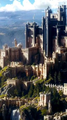 an aerial view of a castle in the mountains