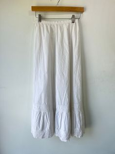 Vintage Victorian White Skirt. Classic crisp white cotton! Doesn't get better than this. In excellent vintage condition, button closure in back. Best fits XS, hand wash cold and line dry. Approximate measurements:Waist: 12" across laying flatLength: 32" White Relaxed Cotton Skirt, White Relaxed Fit Cotton Skirt, White Buttoned Skirt For Daywear, Cotton Skirt For Daywear, Vintage White Lined Skirt, Cotton Long Skirt With Buttons, White Cotton Bottoms For Daywear, Classic Cotton Lined Skirt Bottoms, Classic Cotton Relaxed Skirt