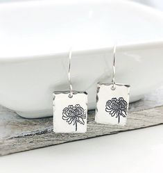 "Birth Flower Jewelry, Flower Earrings, Morning Glory Earrings, Anniversary gift for her, Girlfriend Gift, Birthday Gift, September Birthday 5/8\" sterling silver rectangles are personalized with the flower of your choice. They are given a hammered edge finish to catch the light and add some sparkle. Choose your month during checkout. The rectangles hang from sterling silver ear wires. The earrings measure about 1.5\" from the top of the ear wires to the bottom of the oval." Sterling Silver Flower Earrings For Anniversary And Mother's Day, Mother's Day Sterling Silver Birth Flower Earrings, Sterling Silver Flower Earrings For Mother's Day, Mother's Day Nickel-free Sterling Silver Flower Earrings, Flower Charm Earrings For Mother's Day Anniversary, Dainty Birth Flower Earrings For Mother's Day, Flower Charm Earrings For Anniversary And Mother's Day, Flower Charm Earrings For Anniversary On Mother's Day, Birth Flower Earrings For Anniversary