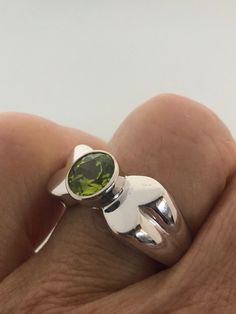 Rich bright Peridot green ring Sterling silver Tarnished with age, can be polished up. Size 7 can be sized by my jeweler. His service charge is $10-$20 All rings are shipped free in the US in a nice gift box. Check out our over a THOUSAND great reviews Engraving is $4 per letter and is not always perfect depending on the piece. It can take a few days if the jeweler is busy. This is payable to Paypal Judithsltd@gmail.com Green Emerald Ring With Sterling Silver, Green Hallmarked Open Ring, Unique Sterling Silver Green Emerald Ring, Modern Sterling Silver Green Rings, Green Oval Sterling Silver Rings, Modern Green Sterling Silver Rings, Green Sterling Silver Oval Rings, Green Sterling Silver Solitaire Ring, Sterling Silver Polished Emerald Ring