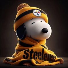 a snoopy dog wearing a yellow and black hat with the pittsburgh football team on it