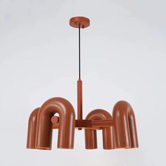 a brown light fixture hanging from a ceiling