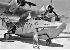 a man standing in front of an airplane