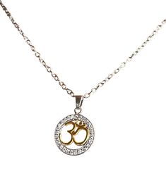 Om Charm Pendant with Chain (925 Silver with Gold Plating) Material: Base: 925 Sterling Silver (durable, hypoallergenic for most people) Accents: 14k yellow gold plating (for a touch of elegance) on specific elements Design: Pendant: 925 Silver Om symbol in a delicate design (cut-out, etched, etc.) Chain: 925 Sterling silver chain with a spring clasp closure Perfect for: Those who follow Hinduism, Buddhism, or appreciate the spiritual meaning of Om Layering with other necklaces for a personalized look A meaningful gift for someone who enjoys yoga or meditation Note: Gold plating adds a touch of luxury but can wear off over time with exposure to chemicals (perfume, lotions) . Proper care (storing in a pouch, avoiding harsh chemicals) can extend the life of the plating. Symbolic Necklace With Silver Chain And Round Pendant, Symbolic Necklaces With Silver Chain And Round Pendant, Spiritual Silver Charm Necklace For Anniversary, Spiritual Silver Locket Necklace For Anniversary, Spiritual Silver Chain Necklaces As Gift, Spiritual Silver Chain Necklace As Gift, Spiritual Necklace With Silver Chain As Gift, Symbolic Silver Pendant Necklace, Symbolic Silver Charm Necklace With Adjustable Chain