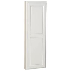 a tall white door on the side of a wall