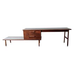 two wooden desks with drawers on each side