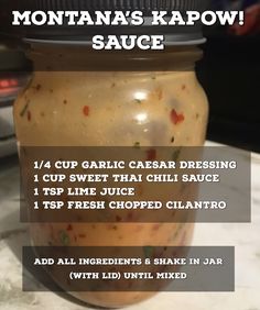 a jar filled with sauce sitting on top of a counter