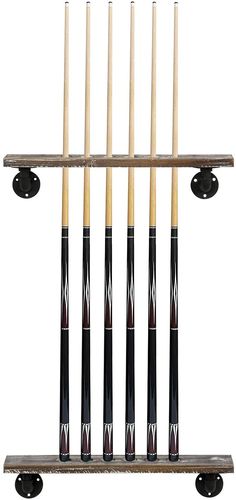 eight pool cues hanging from a rack with four cues on it's sides