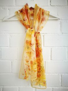 Hand painted Marigold flowers garlands fluttering in the wind. Few ribbons and some calendulas and cosmos flowers plaited into this beauty too. Lots of natural size and color blossoms and small petals. Cheerful colors: yellowish, orange, radish and cozy buttery background -------------------------------------------------------------------------------------------------------------------------------------------------------------------- This design Scarf is MADE TO ORDER and available in 2 SQUARE a Yellow Artistic Silk Scarf For Spring, Artistic Yellow Silk Scarf For Spring, Spring Yellow Floral Print Dupatta, Yellow Silk Scarf For Spring Gift, Yellow Silk Scarves For Gifts, Spring Yellow Dupatta With Floral Print, Yellow Floral Print Dupatta For Spring, October Born, Pocket Handkerchief