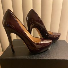 Gorgeous Burgundy Prada Heels With Hidden Platform Worn Only Once & They Are In An Amazing Condition - Comes With The Prada Box In Picture (Not The Original Box Shoes Came In) Sleek Brown Heels For Formal Occasions, Sleek Brown Formal Heels, Brown Patent Leather Heels For Formal Occasions, Formal Brown Patent Leather Heels, Designer Brown Patent Leather Heels, Elegant Brown Platform Heels, Leather High Heels, Prada Shoes, Patent Leather