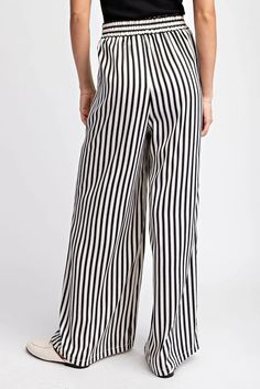 Unlock your adventurous style with our Striped Elastic Waist Straight Leg Pants! The bold stripes and comfortable elastic waistband will give you the confidence to take on any challenge, while the straight leg design adds a touch of sophistication. Perfect for those who like to take risks and make a statement. Striped Wide-leg Pants With Elastic Waistband, Striped Wide Leg Trousers With Elastic Waistband, Casual Wide-leg Pants With Vertical Stripes, Striped Straight Leg Bottoms With Elastic Waistband, Casual Wide-leg Vertical Stripes Pants, Relaxed Fit Vertical Stripes Wide-leg Pants, Relaxed Fit Wide-leg Striped Bottoms, Casual Wide Leg Ankle-length Striped Pants, Striped Straight Leg Pants With Elastic Waistband