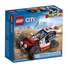 a lego box with a red and white buggy in it's front end