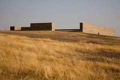 the building is on top of a hill with no people or animals in front of it