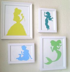 four silhouettes of princesses are hung on the wall