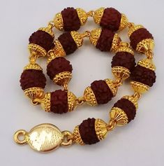 Fabulous handmade 22karat genuine lab tested or 916/22k hallmarking bracelet with natural rudraksha beads indian jewelry  metal: 22k yellow gold bracelet  size 7.5",8.0",8.5",9" approx. weight-8.500 grams approx. Brand-handmade. material-gold, natural rudraksha beads. makes excellent gift item and collection piece  condition: excellent condition - brand new. for more information please see the photo's gold jewelry is handmade designer jewelry. so, there can be slight difference in size and weigh Rudraksha Bracelet, Rudraksha Beads, Photo Gold, Designer Handmade Jewellery, Jewelry Metal, Beads Handmade, Yellow Gold Bracelet, Handmade Bracelet, Vintage Designer