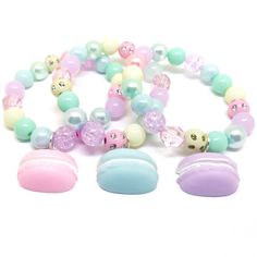 These adorable bracelets are the perfect favor for your little one's macaroon themed party! Each bracelet features a pastel resin macaroon charm, resin rhinestone beads and an assortment of pastel 10mm acrylic beads strung with durable stretch floss cord. You will receive a mix of charm colors. Each bracelet will arrive individually packaged in organza bags. Please select the number of bracelets and bracelet size needed from the drop down menu. Please message me if you have any questions. These Cute Plastic Stretch Bracelet Gift, Cute Plastic Stretch Bracelet As Gift, Trendy Plastic Jewelry For Birthdays, Cute Round Beads Jewelry For Party Favors, Cute Birthday Bracelets, Sweet Beaded Bracelets For Birthday, Cute Round Beaded Bracelets For Birthday, Sweet Beaded Bracelets With Round Beads For Birthday, Sweet Beaded Jewelry For Birthday