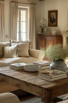 a living room filled with furniture and a fire place in front of a couches