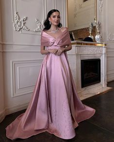 This luxurious Dreamy Vow evening dress features a stunning off-the-shoulder design, made with high-quality pink satin. The elegant train adds a touch of drama to this Arabic-inspired gown, perfect for any special occasion. Elevate your style and make a statement with this beautiful piece from the SS481 collection. Pink Gown With Sweep Train For Banquet, Pink Satin Dress For Gala, Pink Gown With Detachable Train For Prom, Elegant Pink Gown With Detachable Train, Pink Evening Dress With Sweep Train For Banquet, Pink Gala Gown With Sweep Train, Elegant Satin Ball Gown With Long Train, Pink Evening Dress With Detachable Train For Gala, Pink Satin Ball Gown For Party