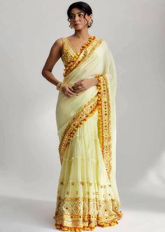 With its rich fabric, mirror work, pompoms, tassels and intricate embroidery, the samaya sari is a testament to the beauty of indian textile art. It is a timeless piece that celebrates tradition while embracing modern elegance, making it a perfect choice for weddings, festive occasions and cultural celebrations. Drape yourself in the allure of the samaya sari and make a lasting impression wherever you go. Fabric Mirror, Gopi Vaid, Haldi Outfits, Indian Sari Dress, Sari Dress, Desi Fashion Casual, Saree Designs Party Wear, Indian Dresses Traditional, Desi Clothes