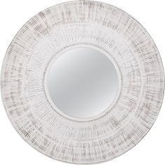 a white round mirror with lines on the bottom and sides, hanging from a wall