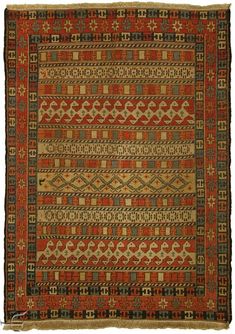 an old rug with many different colors and patterns