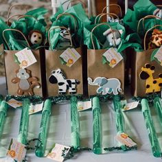 several small bags with animals on them are sitting on a table next to each other